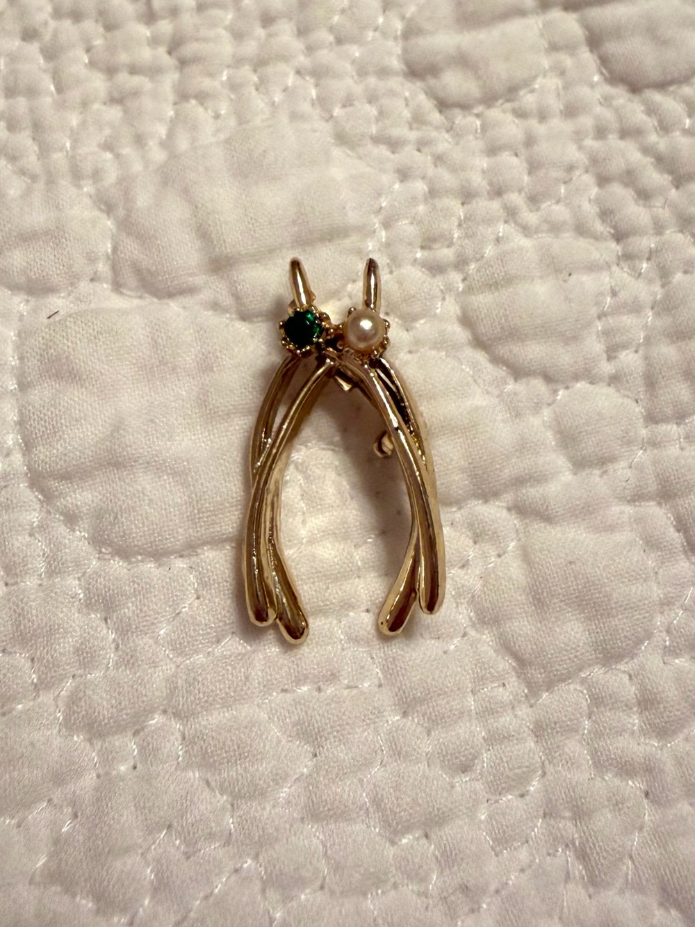 Vintage Gold tone wishbone brooch with green emerald gemstone and pearl